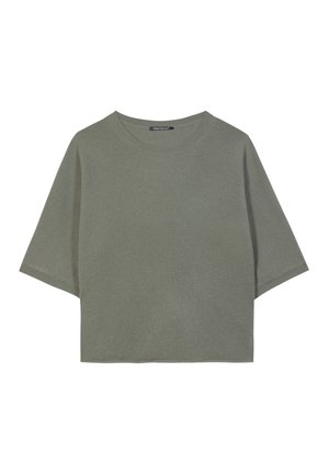 Olivgrünes, kurzes T-Shirt aus weichem Stoff. Mit rundem Halsausschnitt und kurzen, weiten Ärmeln in lockerer Passform. Einfaches Design.