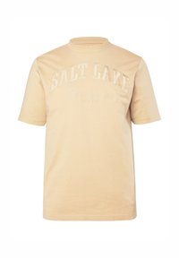 T-shirt beige a maniche corte con scollo rotondo e stampa frontale con la scritta "SALT LAKE" e dettagli ricamati. Tessuto dalla consistenza morbida.