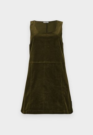 Suknja od pana u tamno maslinasto zelenoj boji, s izrezom u obliku širokog slova "U", bez rukava, A-linije s vidljivim detaljima šava.