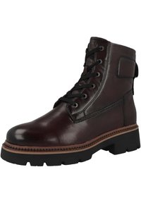 Stivale alla caviglia in pelle marrone con punta rotonda, lacci neri e suola in gomma robusta. Presenta cuciture decorative e una linguetta sul tallone.