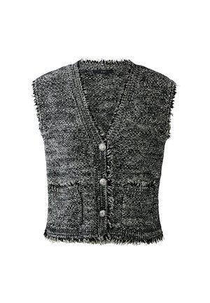 Un débardeur en tricot sans manches texturé noir et blanc avec un col en V, trois boutons argentés, deux poches avant et des bords effilochés.