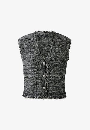 Un débardeur en tricot sans manches texturé noir et blanc avec un col en V, trois boutons argentés, deux poches avant et des bords effilochés.