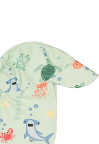 Helles grünes Sonnenhütchen aus Stoff, gestaltet mit Mustern maritimer Lebewesen wie Haien, Schildkröten und Quallen, und einem breiten Rand zum Sonnenschutz.