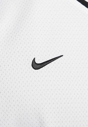 White athletic jersey with a perforated texture featuring a prominent black Nike swoosh logo embroidered on the chest area.