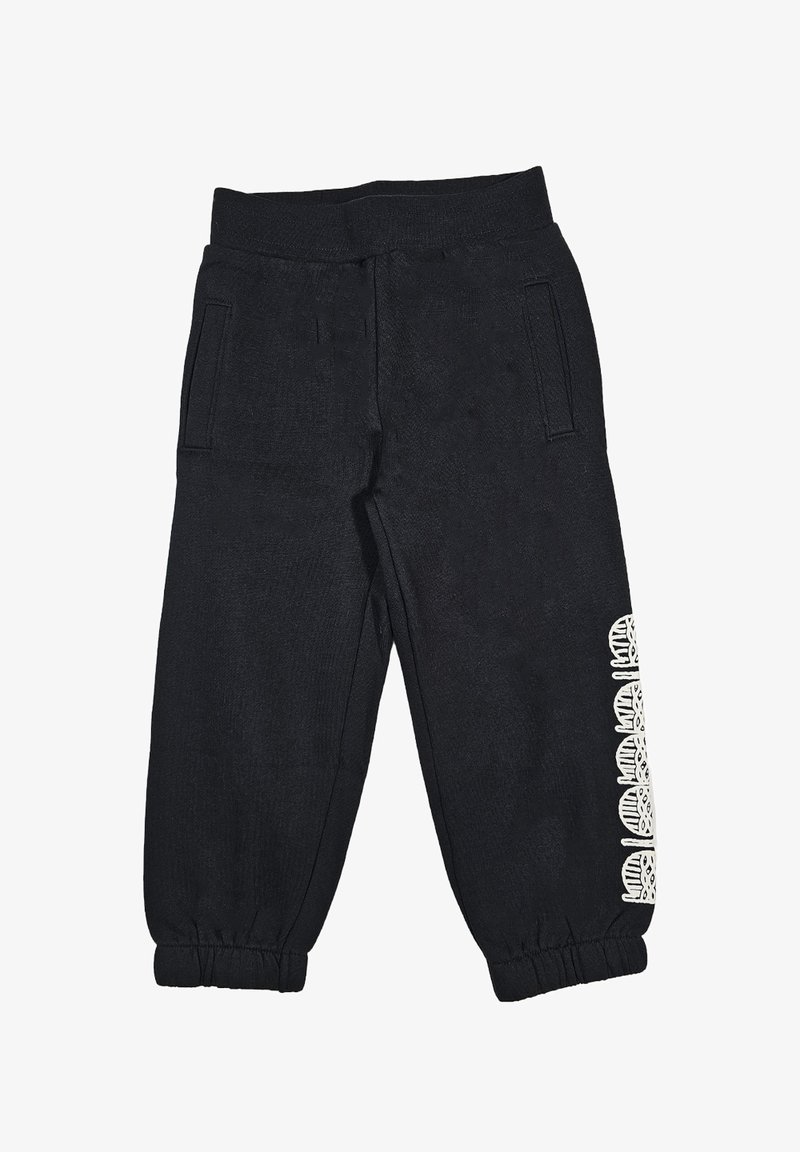 Pantaloni sportivi neri realizzati in un tessuto testurizzato, con vita a coste, tasche laterali e dettagli bianchi decorati lungo una gamba.