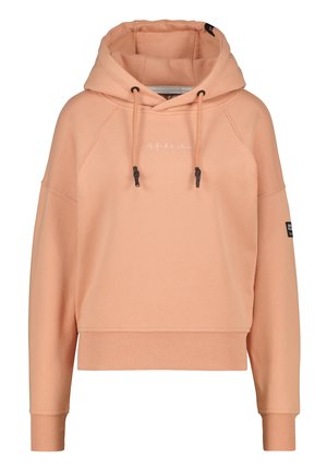 Haut court de couleur pêche avec cordons, manches longues, poignets et ourlet côtelés, et texte blanc brodé sur la poitrine.