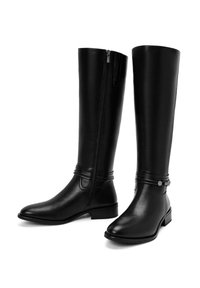 Black leather knee-high boots with a side zipper, smooth texture, rounded toe, and a strap detail across the ankle with a small decorative accent.