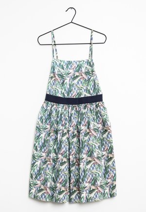 Mouwloze jurk met verstelbare bandjes, donkere tailleband en groen, roze en blauw bladmotief, hangend aan een zwarte hanger.