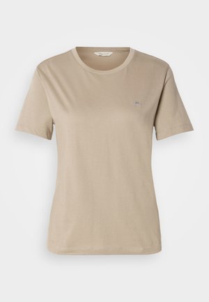 Tan short-sleeve t-shirt made of soft cotton, featuring a round neckline and a small embroidered logo on the chest. Smooth texture.