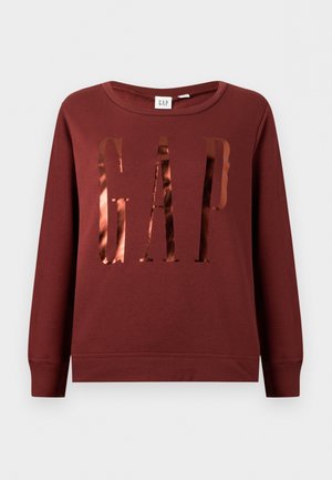 Bluză cu mânecă lungă, de culoare burgundă, cu un logo „GAP” lucios cu nuanță de cupru pe piept și decolteu rotund.