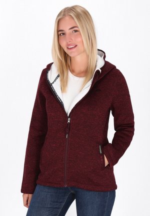 Burgunderfarbener Fleece-Jacke mit weißem Futter, Reißverschluss vorne, Kapuze, Seitentaschen und strukturiertem Stoff. Mit Logoakzent am Reißverschluss.