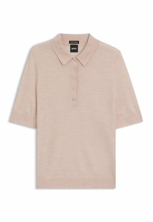 Light pink short-sleeve polo shirt made from soft merino wool, featuring a classic collar and four buttons at the front.