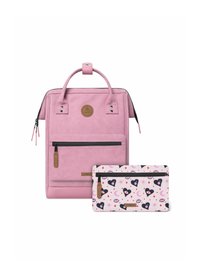 Pink faux leather backpack with top handle, front zip pocket; includes a patterned pink pouch with hearts, eyes, and crescent moons.