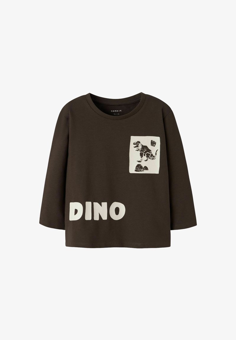 Braunes langärmliges Hemd mit weißem "DINO"-Text und einem Dinosaurier-Graphic auf der Brusttasche. Hergestellt aus weichem Stoff mit einem lässigen Schnitt.