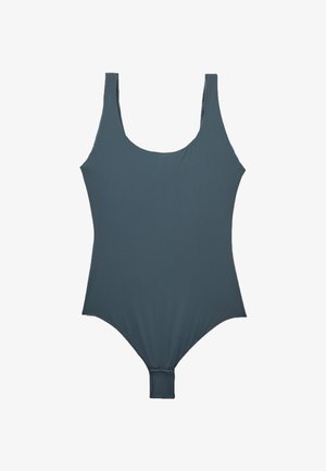 Donker tealgroene mouwloze overall met een ronde hals en drukknoopsluiting in het kruis, plat gelegd op een witte achtergrond.