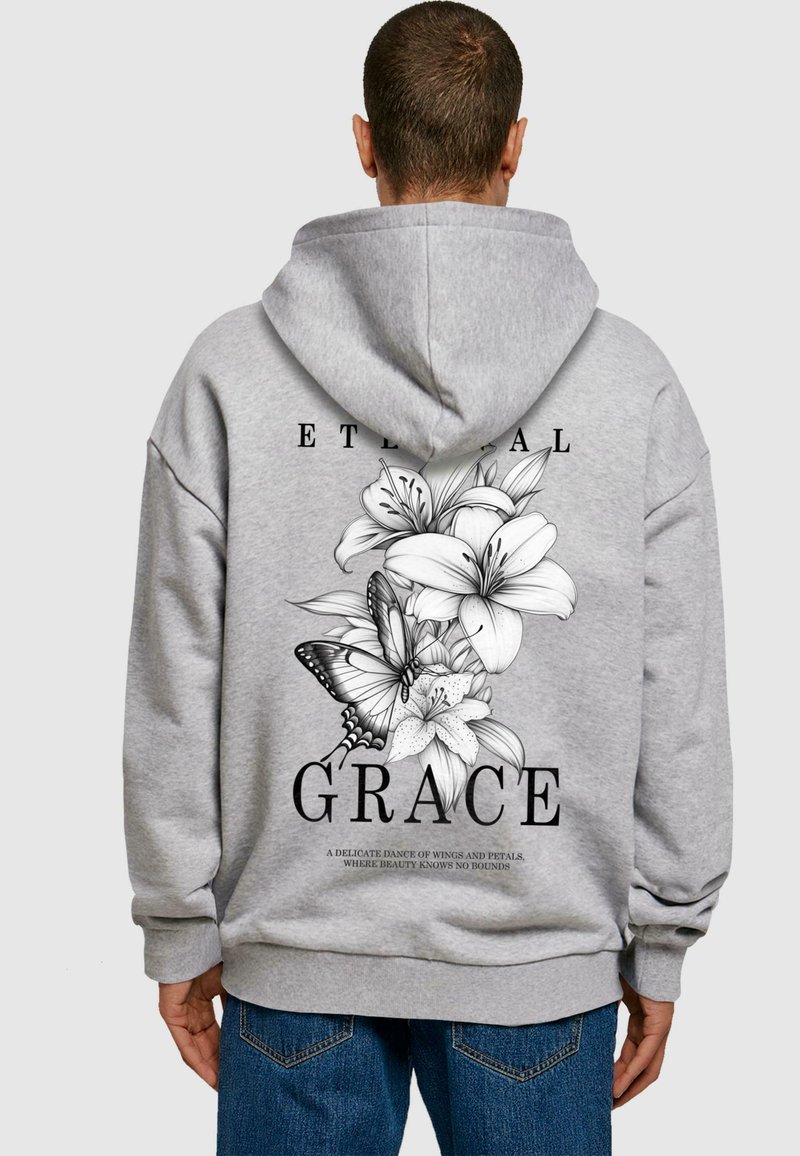 Gray hoodie featuring a floral design with lilies and a butterfly on the back, accompanied by the text "ETERNAL GRACE" in bold lettering.