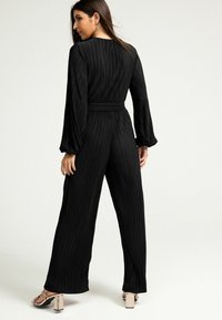 Next Kombinezons - black