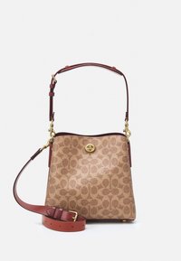 Brown patterned handbag with a gold logo, featuring leather accents and a removable shoulder strap. Includes a sturdy top handle.