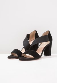 Pier One Sandaalit nilkkaremmillä - black