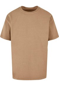 Brun kortærmet T-shirt lavet af bomuld. Rund halsdesign med en afslappet pasform. Glat tekstur og ensfarvet uden synlige mønstre eller detaljer.