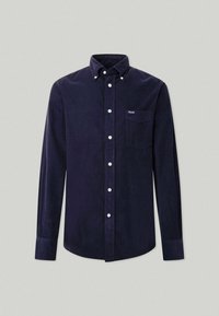 Camisa de pana azul marino con mangas largas, cuello abotonado, bolsillo frontal y botones blancos. Tejido texturizado con costuras verticales.
