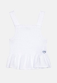 Weißes, geschmücktes Oberteil mit breiten Trägern, gerafftem Saum und einem kleinen blauen Herzlogo an der Seite. Hergestellt aus weichem Stoff für den Komfort.