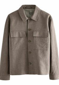 Chaqueta de lino marrón con cuello, dos bolsillos frontales y cierre de botones. Tejido texturizado con un ajuste ligeramente holgado.