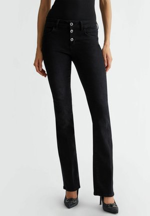 WITH BUTTONS - Traperice krojene za nošenje s čizmama - black