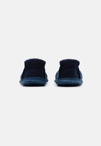 Navy blue slippers with a textured felt upper and a contrasting blue rubber sole. Features a low back and slip-on design for easy wear.