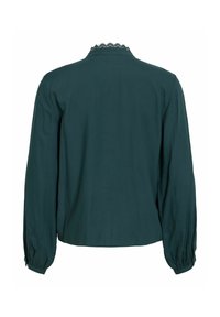 Blouse vert foncé à manches longues avec des poignets froncés et une bordure en dentelle festonnée autour du col, vue de dos.