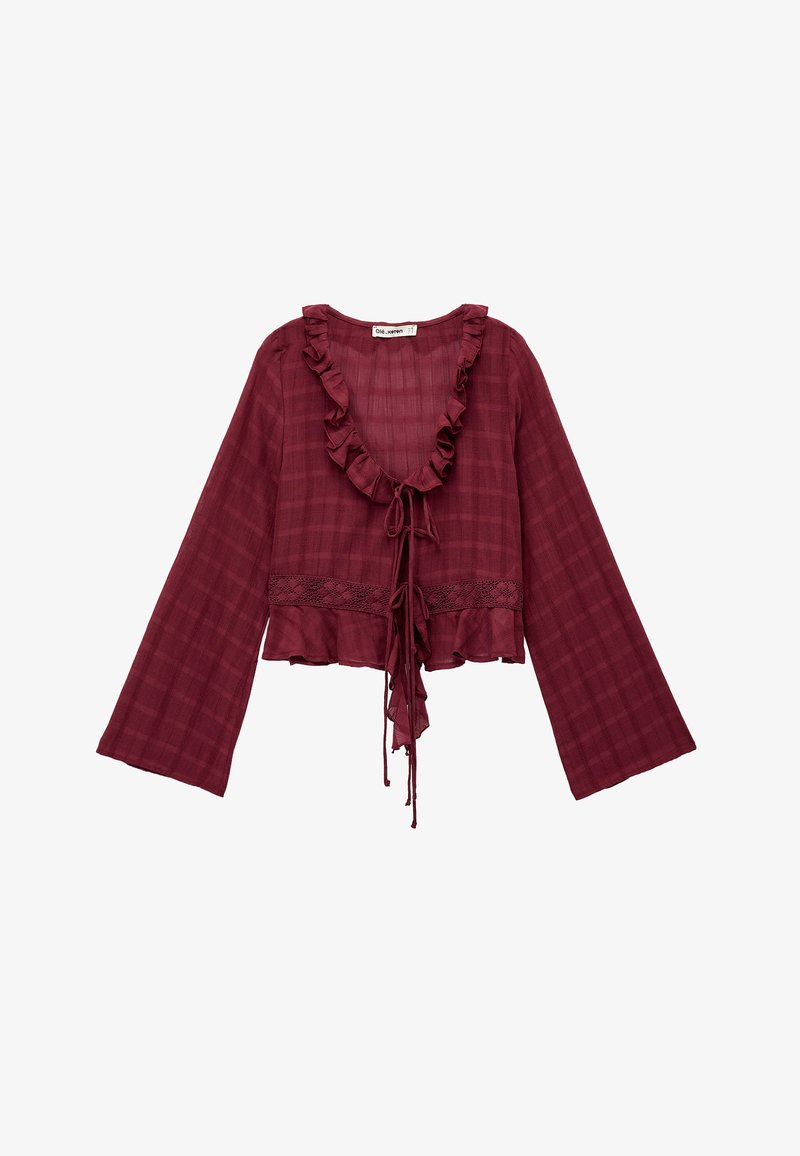 Blusa de cuadros burdeos con escote y mangas con volantes. Presenta un cierre con lazo y un borde de encaje en el dobladillo. Fabricada en tejido ligero.