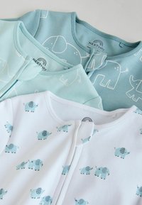 Three baby onesies in soft cotton. Light blue with white elephant patterns, and a white one with small blue elephants. Front snap closures.