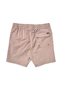 Shorts en coton beige clair avec une taille élastique, une poche arrière simple et une texture subtile. Présente une petite étiquette de marque près de la poche.