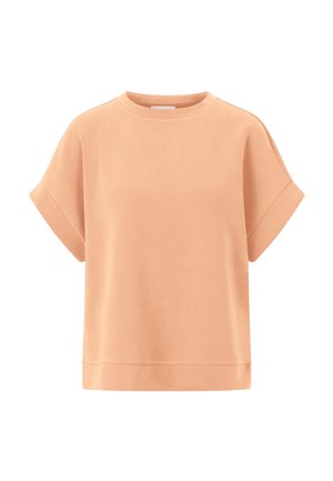 Sweat-shirt à manches courtes de couleur pêche, col rond, avec des poignets retroussés et un ourlet droit.