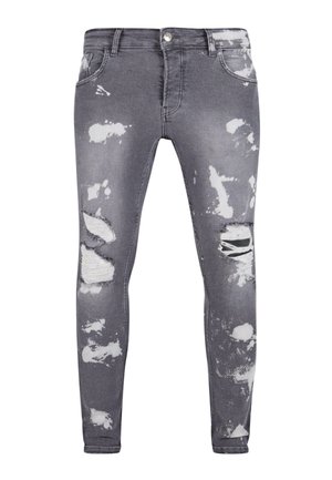 Skinny jeans in een vervaagde grijze was met versleten scheuren. Kenmerken zijn onder andere een vijf-pocket ontwerp en een metalen knoopsluiting. Gestructureerde stof.