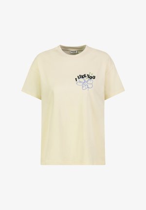 Cream short-sleeve t-shirt with round neck and chest print featuring blue flower and "I LIKE YOU" text with small green hearts.