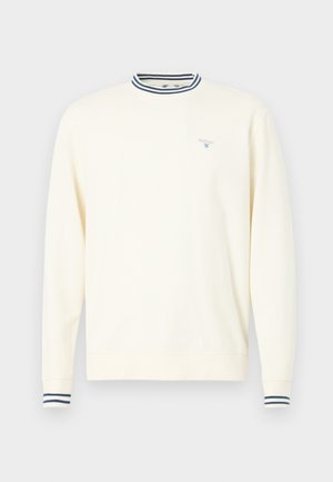 Kremowy sweter z długimi rękawami, w paski granatowo-białe ściągacze kołnierza i mankietów, z małym niebieskim logo na klatce piersiowej.