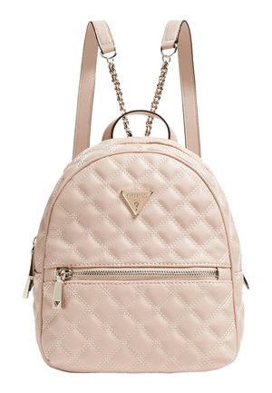 Small quilted pale pink backpack with front zip pocket, gold-tone chain-link and leather straps, and a triangular Guess logo on front.