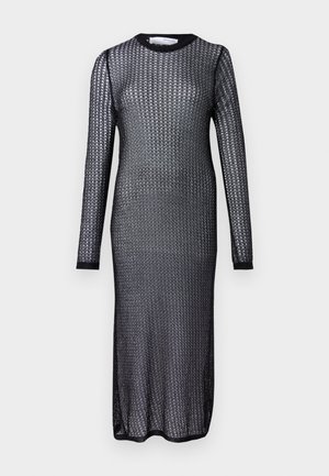 Robe noire à manches longues en tissu tricoté transparent, dotée d'un col rond et d'une silhouette slim et ajustée.