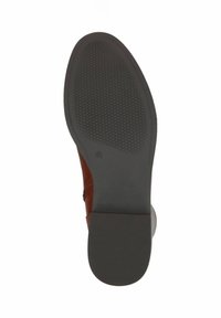 Semelle en cuir marron avec un dessous en caoutchouc noir texturé, présentant une forme lisse et arrondie ainsi qu'un talon plat. Taille clairement imprimée visible.