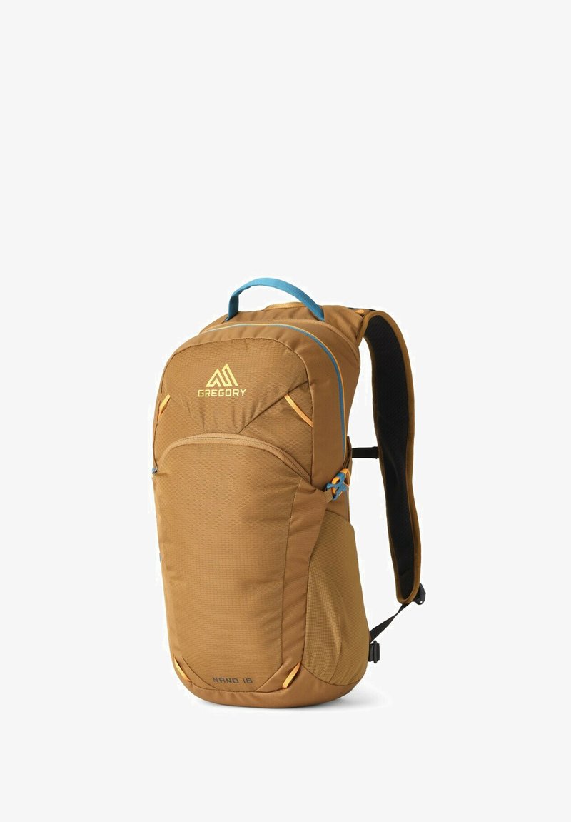 Brown backpack with blue accents and logo. Features textured fabric, padded back, adjustable straps, and zipper compartments for storage.