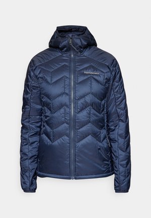 Marineblaue Steppjacke mit Kapuze, ausgestattet mit einem Chevron-quilted Muster und einem Reißverschluss. Leichter Stoff und elastische Bündchen für eine enge Passform.