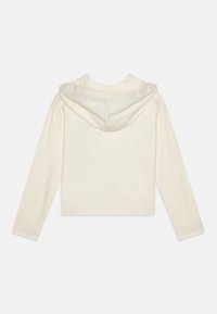 Cropped cream hoodie in soft fabric, featuring a drawstring hood and long sleeves. Simple design with ribbed hem and cuffs.