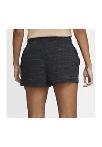 Svart texturerade shorts med en avslappnad passform, utrustade med resårmidja och sidfickor, designade för komfort och rörelsefrihet.