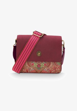 Purple and patterned crossbody bag with a floral print, magnetic flap closure, and a striped adjustable strap. Gold-tone hardware accents.