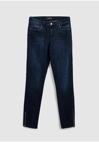 Tmavě modré džíny z denimu, s úzkým střihem, pěti kapsami a zipovými detaily na kotnících. Tkanina má mírně vybledlý vzhled.