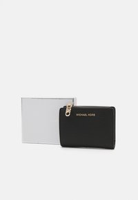Black leather wallet with a textured finish, gold hardware, and zip closure. Accompanied by a silver packaged box.