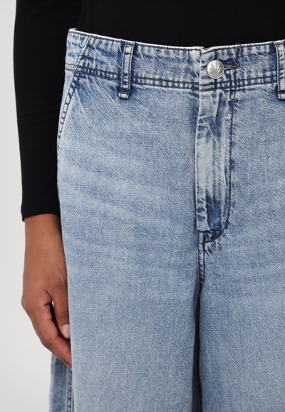 Light blue denim pants with a straight-leg cut, featuring a single metal button, standard belt loops, and a faded texture.