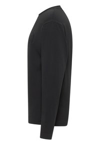 Schwarzes Langarmshirt mit rundem Ausschnitt, aus glattem Stoff. Mit einem dezenten Logodetail auf der Brust, figurbetontes Design.