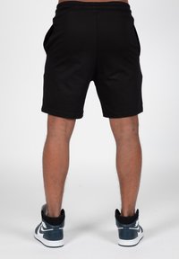 Wrong Friends SAFI - Tracksuit bottoms - black